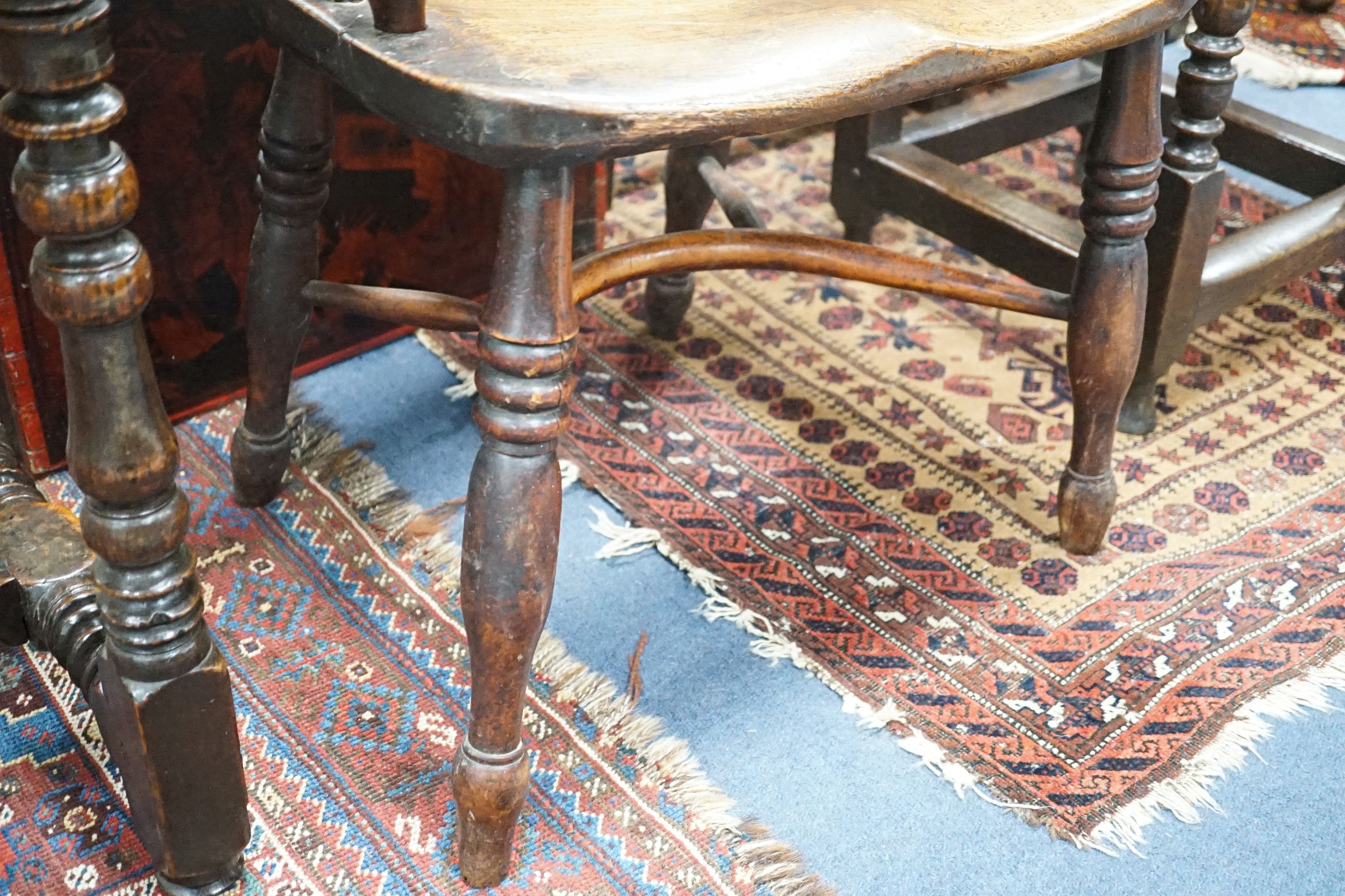 A 19th century Midlands area yew and elm Windsor armchair with crinoline stretcher, width 54cm, depth 40cm, height 108cm